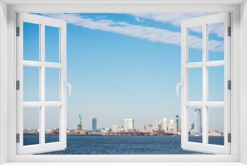 Fototapeta Naklejka Na Ścianę Okno 3D - New York City Skyline over the waterfront, with Statue of Liberty