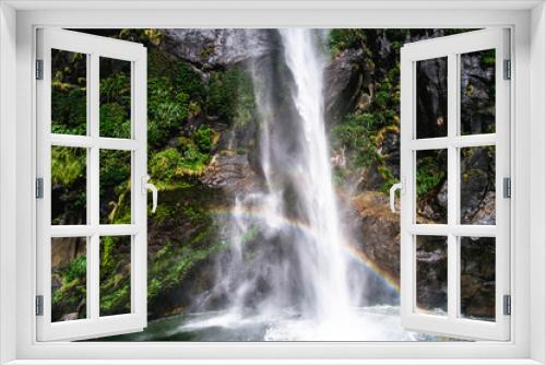 Fototapeta Naklejka Na Ścianę Okno 3D - A stunning scene under waterfalls while cruising at Milford Sound, New Zealand.