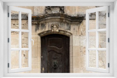 Fototapeta Naklejka Na Ścianę Okno 3D - Old wooden door on stone  house  in Les Baux de Provence, France