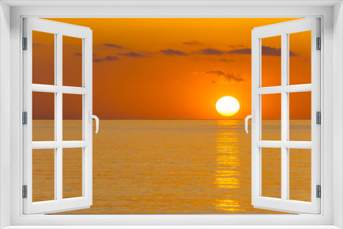 Fototapeta Naklejka Na Ścianę Okno 3D - Mallorca, Orange sunrise reflecting on ocean water