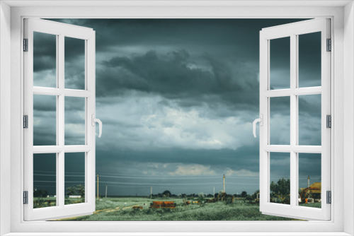Fototapeta Naklejka Na Ścianę Okno 3D - Gloomy thunderous rural landscape. Moody effect.