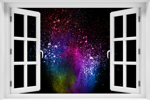 Fototapeta Naklejka Na Ścianę Okno 3D - Abstract multi color powder explosion on black background.  Freeze motion of color dust  particles splash. Painted Holi in festival.