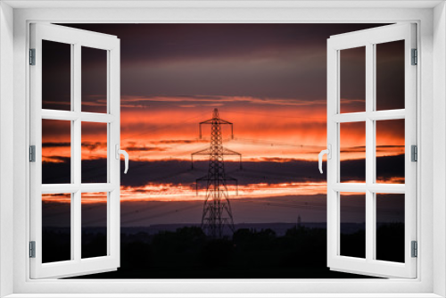 Fototapeta Naklejka Na Ścianę Okno 3D - Power tower at sunset with vignette 