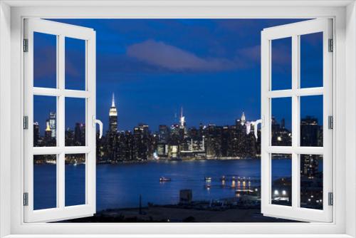 Fototapeta Naklejka Na Ścianę Okno 3D - JUNE 3, 2018 - NEW YORK, NEW YORK, USA  - New York City and East River shows Chrysler Building on right and Empire State Building on Left, as seen from Queens