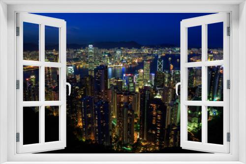 Fototapeta Naklejka Na Ścianę Okno 3D - Hong Kong City Skyline at night time, photo taken from a nearby mountain (Victoria Peak) overlooking the city