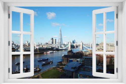 Fototapeta Naklejka Na Ścianę Okno 3D - Aerial drone bird's eye view of iconic Tower Bridge, the Shard and skyline in City of London, United Kingdom