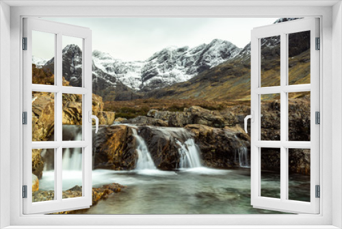 Fototapeta Naklejka Na Ścianę Okno 3D - Fairy Pools waterfall, River Brittle,. Glenbrittle, Isle of Skye, with snow covered mountains in  the background