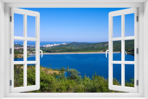 Fototapeta Naklejka Na Ścianę Okno 3D - View of the city of Alushta from the shore of the reservoir, Crimea