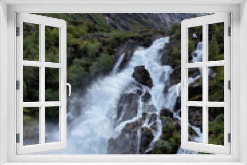 Fototapeta Naklejka Na Ścianę Okno 3D - Small waterfall in Norway. Briksdalsbreen.