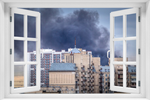 Fototapeta Naklejka Na Ścianę Okno 3D - Fire. Black smoke over the building. City fire. Smoke from a fire.