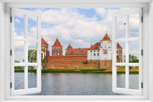 Mir, Belarus. Castle Complex Mir On Sunny Day with blue sky Background. Old medieval Towers and walls of traditional fort from unesco world heritage list