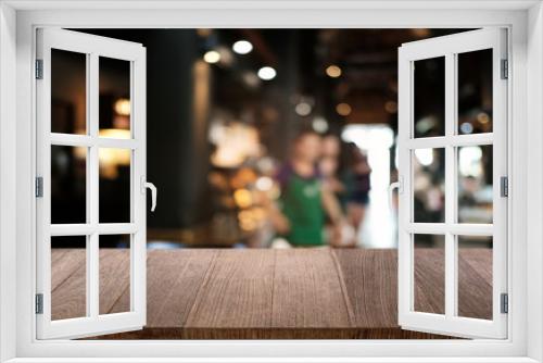 Empty dark wooden table in front of abstract blurred bokeh background of restaurant . can be used for display or montage your products.Mock up for space.