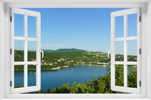 Fototapeta Naklejka Na Ścianę Okno 3D - Top view of the picturesque lake Abrau against the slopes of the Caucasus mountains. Sunny summer day