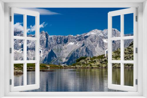 Fototapeta Naklejka Na Ścianę Okno 3D - The Hohe Dachstein mountain range with Spiegelsee in the foreground