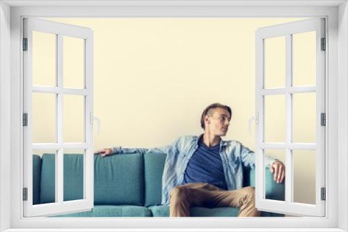 Man sitting on sofa alone