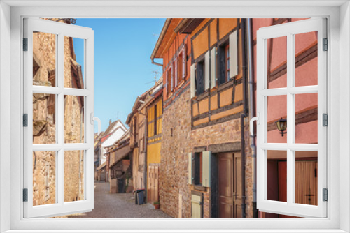 Fototapeta Naklejka Na Ścianę Okno 3D - .Half-timbered architecture in Alsace. The ancient city of Aegisheim. Wine Road Alsace. France.