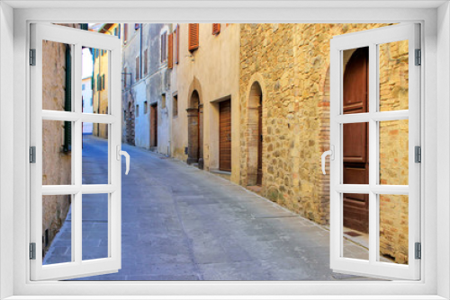 Fototapeta Naklejka Na Ścianę Okno 3D - Narrow street in historic center of  Montalcino town, Val d'Orcia, Tuscany, Italy