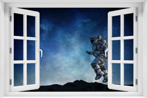 Fototapeta Naklejka Na Ścianę Okno 3D - Spaceman running fast. Mixed media