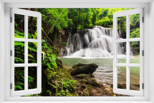 Fototapeta Naklejka Na Ścianę Okno 3D - Beautiful waterfall in tropical rainforest at Kanchanaburi province, Thailand