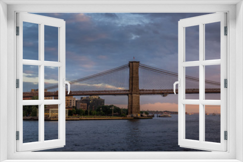 Fototapeta Naklejka Na Ścianę Okno 3D - Sunset view of Brooklyn Bridge on East River, NYC