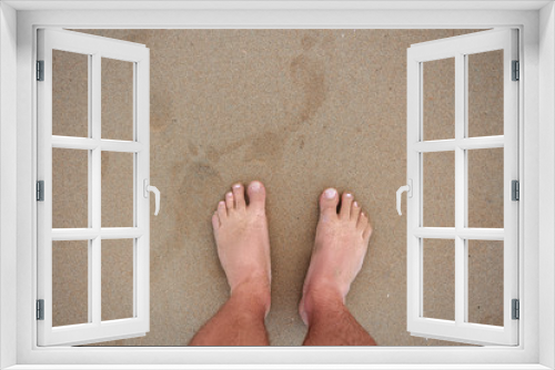 Fototapeta Naklejka Na Ścianę Okno 3D - men's feet on the sand