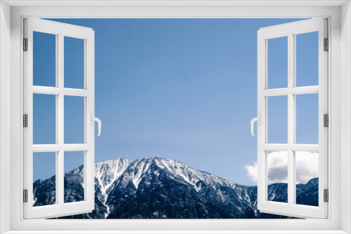 Fototapeta Naklejka Na Ścianę Okno 3D - Cloud Over Snowy Mountain