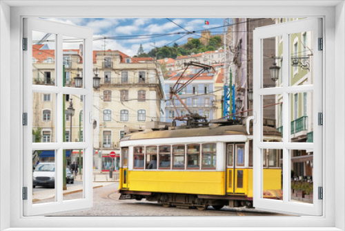 Fototapeta Naklejka Na Ścianę Okno 3D - Vintage Yellow tram in the city center of Lisbon in a beautiful summer day, Lisbon, Portugal.