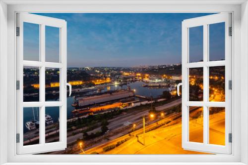 Fototapeta Naklejka Na Ścianę Okno 3D - Night Aerial view of Sevastopol, Crimea. Harbor, cargo ships