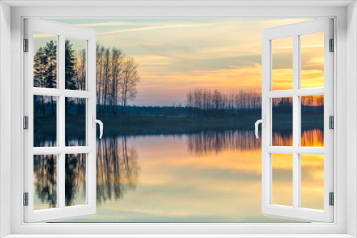 Fototapeta Naklejka Na Ścianę Okno 3D - Sunset on the lake. Reflections in water. 
