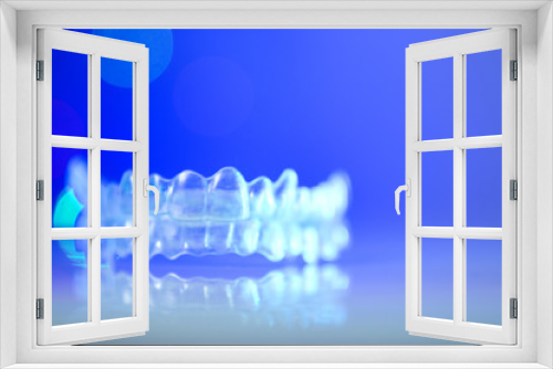 Fototapeta Naklejka Na Ścianę Okno 3D - Invisible orthodontics on bokeh background