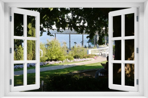 Fototapeta Naklejka Na Ścianę Okno 3D - A picturesque view of the sea coast with a huge number of decorative green plants and flowers
