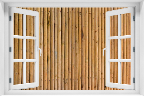 Fototapeta Naklejka Na Ścianę Okno 3D - Close up of textured yellow privacy bamboo screen fence, made from natural organic materials