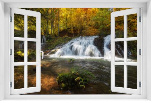Fototapeta Naklejka Na Ścianę Okno 3D - Dokuzak waterfall in Strandja mountain, Bulgaria during autumn. Beautiful view of a river with an waterfall in the forest. Magnificent autumn landscape.