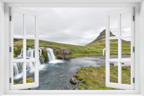 Fototapeta Naklejka Na Ścianę Okno 3D - Landscape view of famous Kirkjufell Mountain and Waterfall landmark with long exposure smooth water wide angle with nobody, Grundarfjordur, green overcast cloudy day