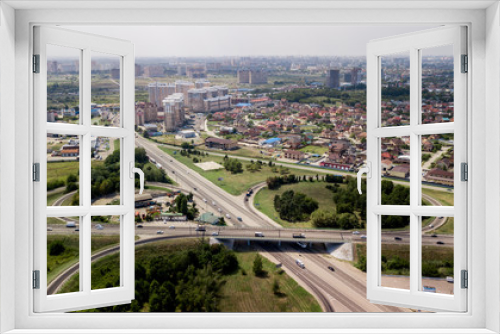 Fototapeta Naklejka Na Ścianę Okno 3D - Aerial shot of a car moving on highway overpass, ringway, roundabout