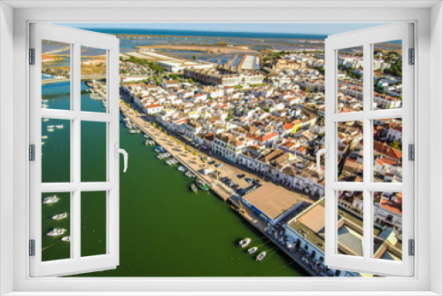 Fototapeta Naklejka Na Ścianę Okno 3D - Portugal. Vista a erea de Tavira en el Algarve con canal y casas
