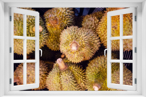Fototapeta Naklejka Na Ścianę Okno 3D - yellow ripe durian with sharp thorn type of tropical fresh fruits , heap of organic nutrition diet fruit at asian market in Thailand . common useful vitamin for good foods .