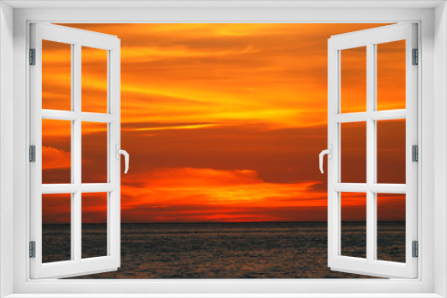 Fototapeta Naklejka Na Ścianę Okno 3D - Orange light in the twilight on sea.