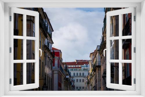 Fototapeta Naklejka Na Ścianę Okno 3D - Buildings in street in Lisbon