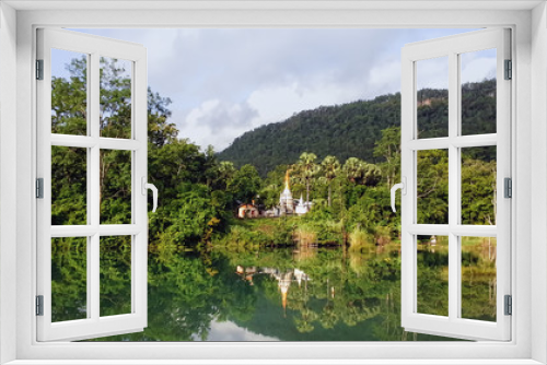 Fototapeta Naklejka Na Ścianę Okno 3D - Landscape Photography of A White Myanmar Style Pagoda / Temple in A Beautiful Environment of Lake, Forest, and Mountains in Ywathit Subtownship, Kayah State, MYANMAR.