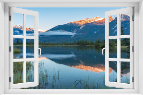 Fototapeta Naklejka Na Ścianę Okno 3D - Mirror Reflection of a Mountain in a Lake Near Jasper Canada