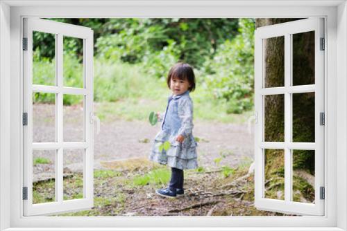 baby girl play in Summer forest park