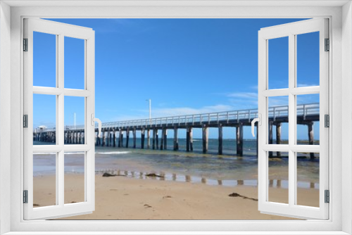 Fototapeta Naklejka Na Ścianę Okno 3D - Long pier on shallow beach