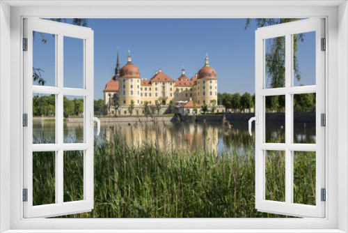 Fototapeta Naklejka Na Ścianę Okno 3D - Castle Moritzburg in Saxony near Dresden in Germany surrounded by pond, reflection blue lake, blue sky