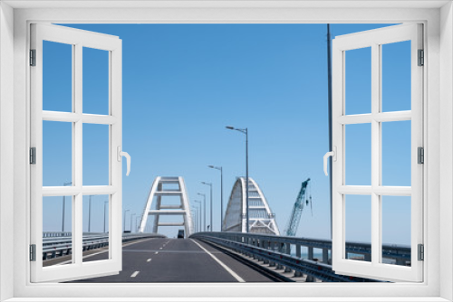 Fototapeta Naklejka Na Ścianę Okno 3D - Cars go on the Crimean automobile bridge