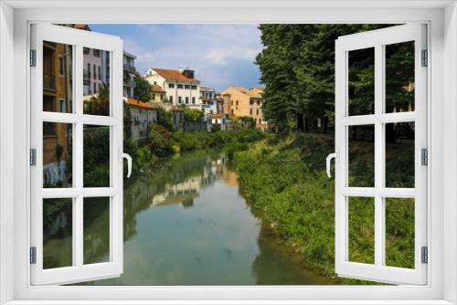 Fototapeta Naklejka Na Ścianę Okno 3D - Padova, Italy - May, 6, 2018: Houses on a bank of channel in Padova