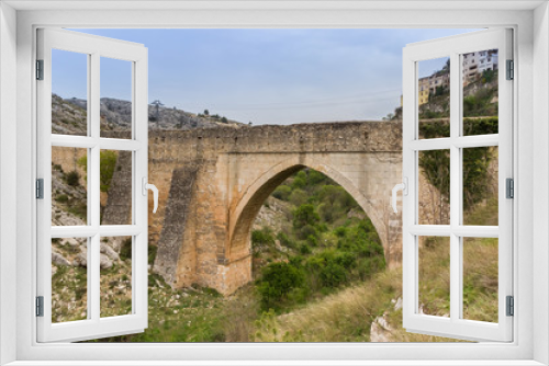 Fototapeta Naklejka Na Ścianę Okno 3D - Old roman bridge in historic town Bocairent, Spain