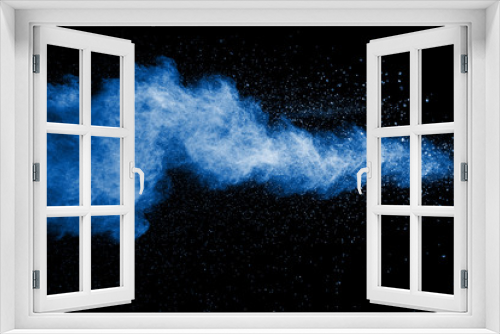 Fototapeta Naklejka Na Ścianę Okno 3D - Splash of blue dust on black background.