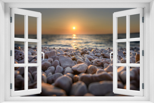Fototapeta Naklejka Na Ścianę Okno 3D - Beach pebbles at sunset, close up macro