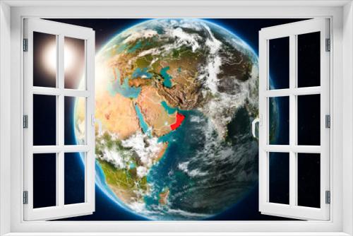 Fototapeta Naklejka Na Ścianę Okno 3D - Oman with sunset from space